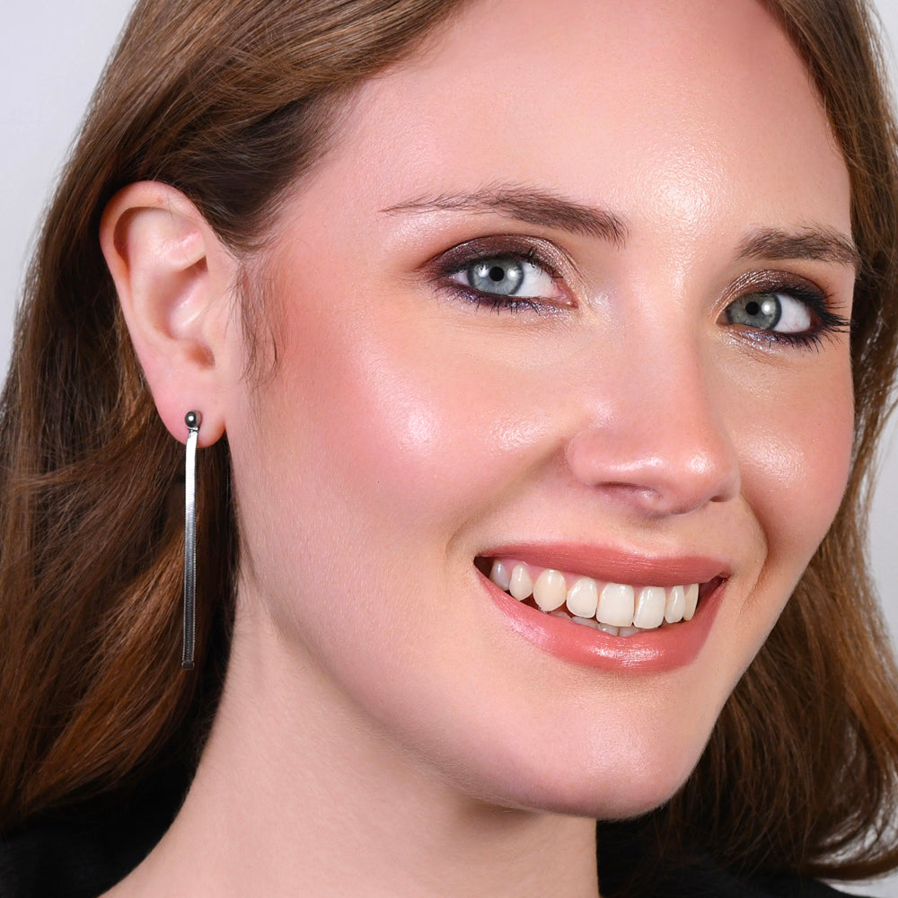 MONO ORECCHINO DONNA IN ACCIAIO CON SFERE