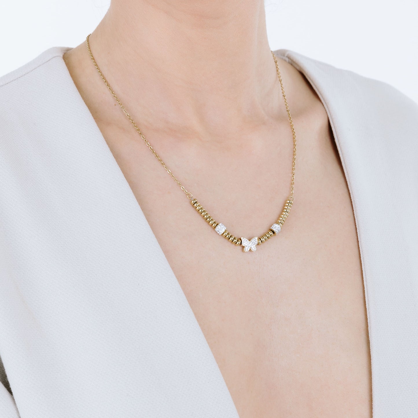 IP GOLD STEEL NECKLACE WITH BUTTERFLY WITH WHITE CRYSTALS