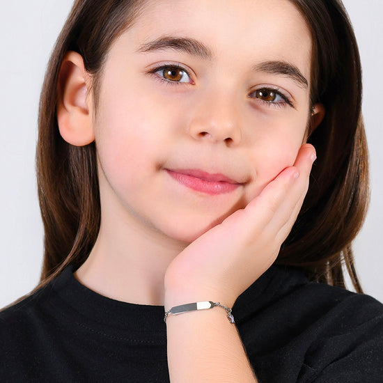 Carica immagine nella Galleria BRACCIALE BAMBINA IN ACCIAIO SMALTO VIOLA E PIASTRA

